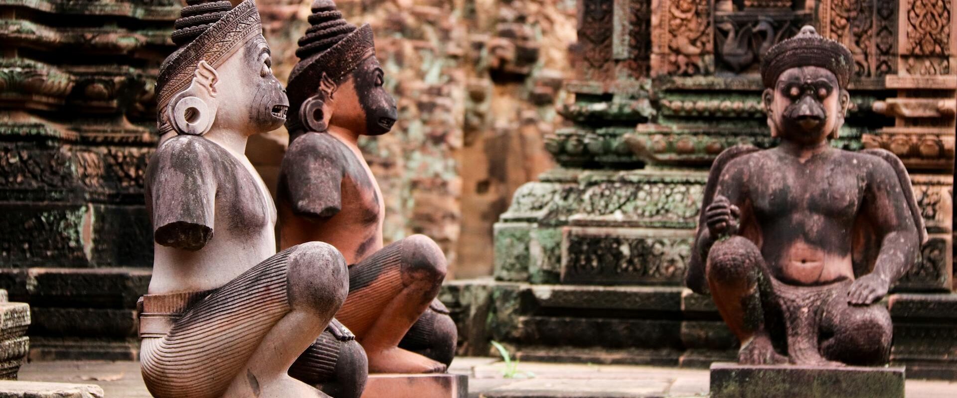 Group enjoying a cultural Banteay Srei Tours visit to Cambodia’s historic pink temple with Legend Travel Group.
